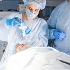 Anesthesiologist assistant concentrates during surgical task. 